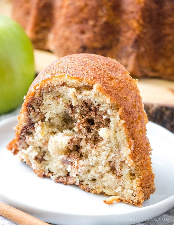 Cinnamon Apple Bundt Cake - A slice of this sweet cake on a white plate.