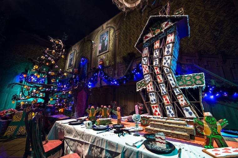 GINGERBREAD HOUSE OF CARDS (ANAHEIM, Calif.) – An annual treat for the Halloween and Holiday seasons at the Disneyland Resort is each year’s new gingerbread house at Haunted Mansion Holiday, a festive attraction guests can experience now through Jan. 6, 2016. A team of Disney bakers, engineers and designers develop the house for the ballroom scene of the Mansion, and this year’s design features clumsy gingerbread men constructing a teetering “House of Cards.” (Disneyland Resort)