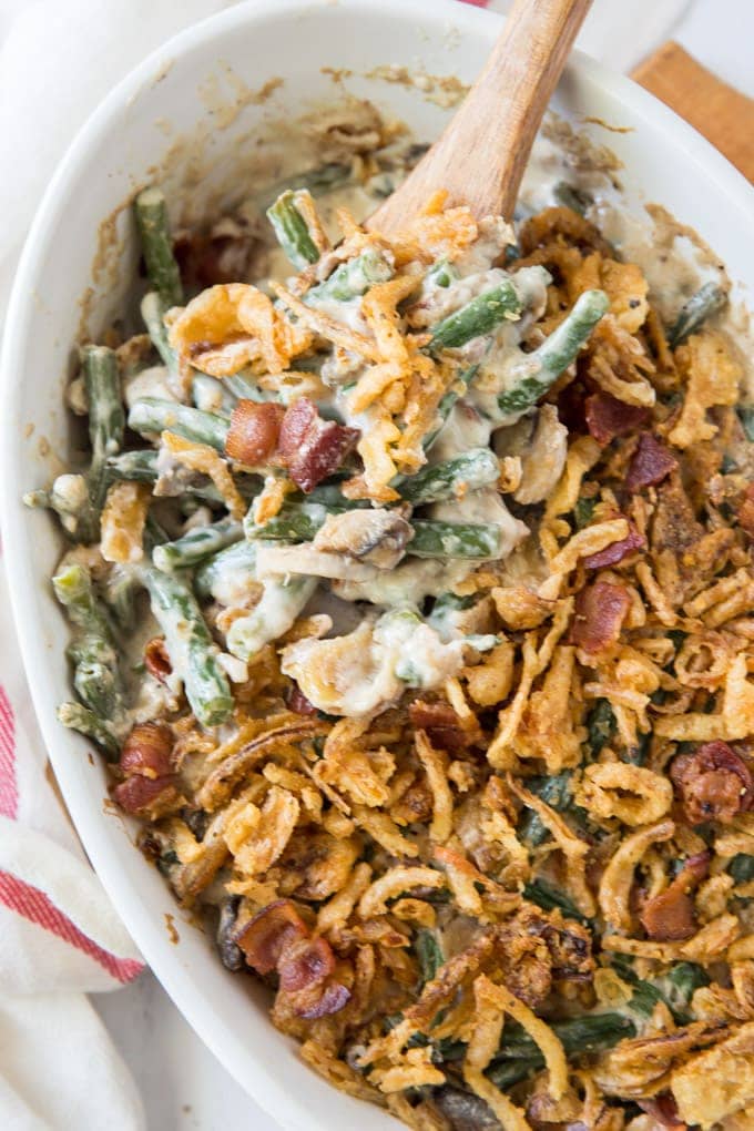 an overhead shot of green bean casserole with bacon and fried onions.