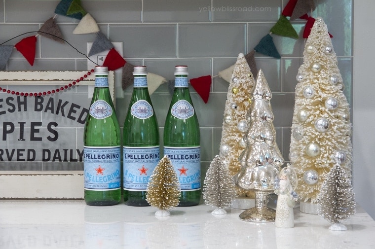 Christmas kitchen bottle brush trees and green bottles