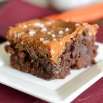 A close up of a brownie on a plate
