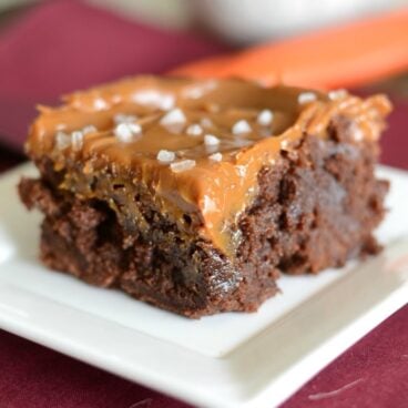 A close up of a brownie on a plate