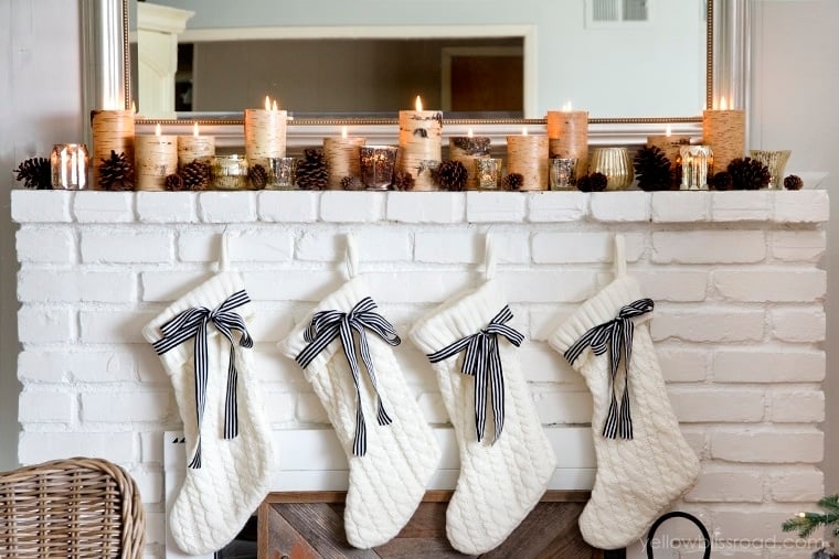 Gorgeous decorated Christmas mantel with pinecones, birch and mercury glass