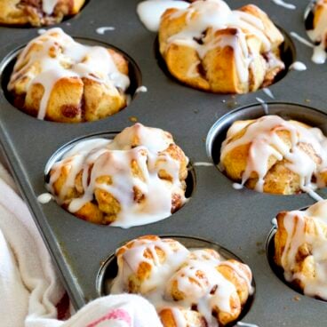 A pan full of cinnamon roll muffins