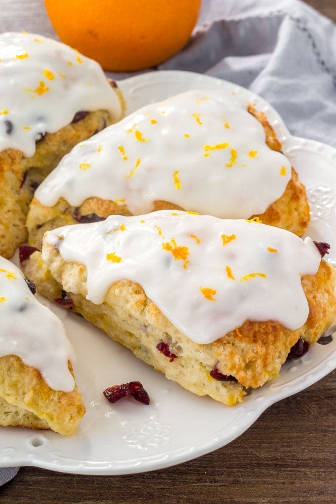 These Cranberry Orange Scones are buttery, tender and flaky with a creamy orange glaze, and they are the perfect breakfast for Christmas morning! Cranberry Orange Scones