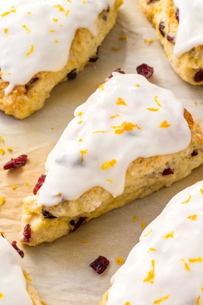 These Cranberry Orange Scones are buttery, tender and flaky with a creamy orange glaze, and they are the perfect breakfast for Christmas morning! A Cranberry Orange Scone with Orange Glaze