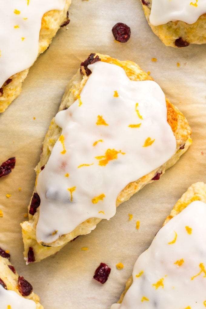 These Cranberry Orange Scones are buttery, tender and flaky with a creamy orange glaze, and they are the perfect breakfast for Christmas morning! Cranberry Orange Scones for Christmas Breakfast