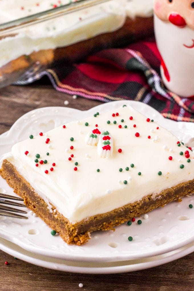 Spiced Gingerbread Cookie Bar on a white place with a Santa mug in the background.