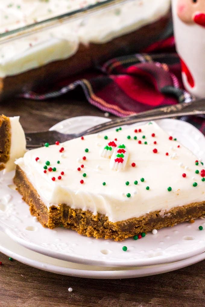 Spiced Gingerbread Cookie Bar on a white plate with a bit taken out of it.