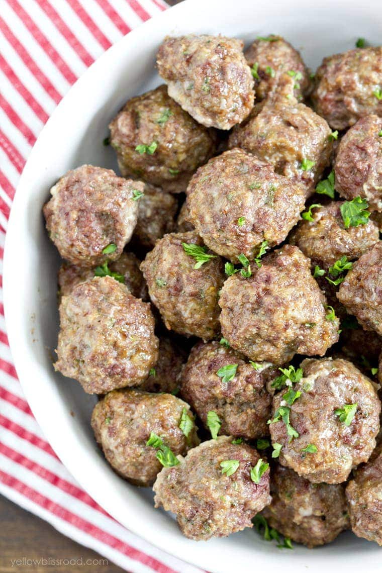 A white bowl filled with homemade meatballs