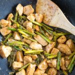 A pan filled with meat and vegetables