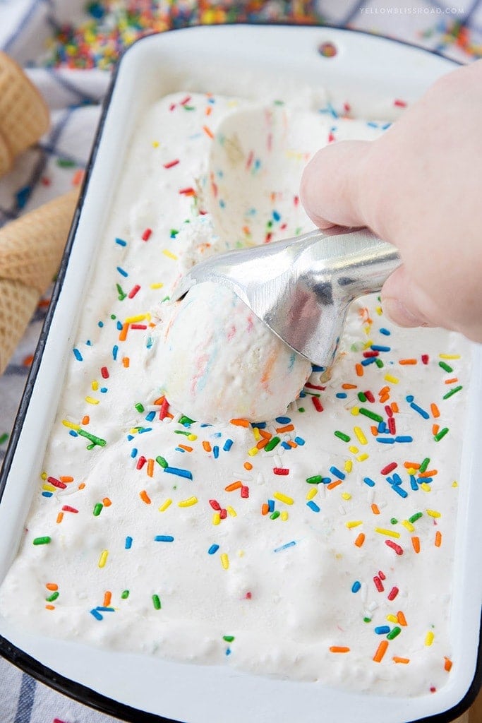ice cream with sprinkles, a loaf pan, an ice cream scoop, ice cream cones