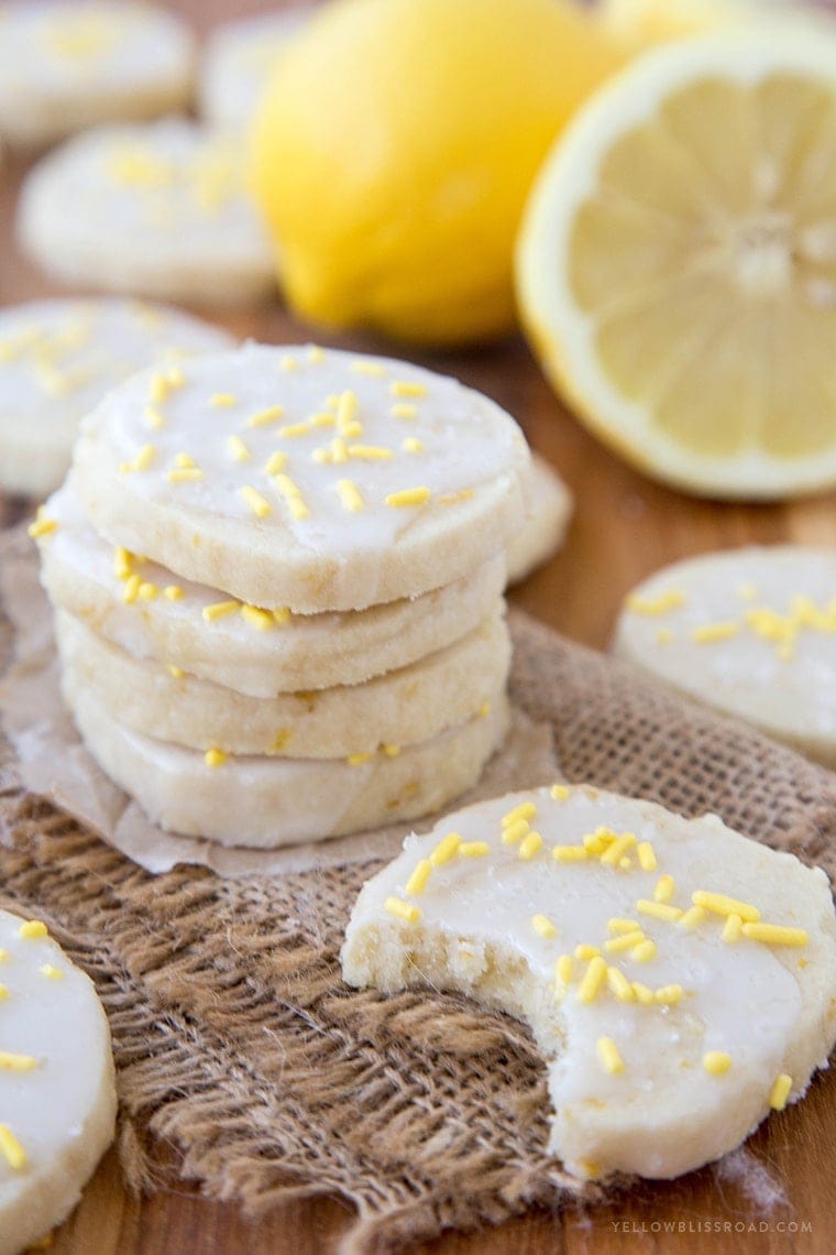 Lemon Shortbread Cookies - Rich, buttery cookies with a hint of lemon, smothered in a sweet and tart lemon icing.