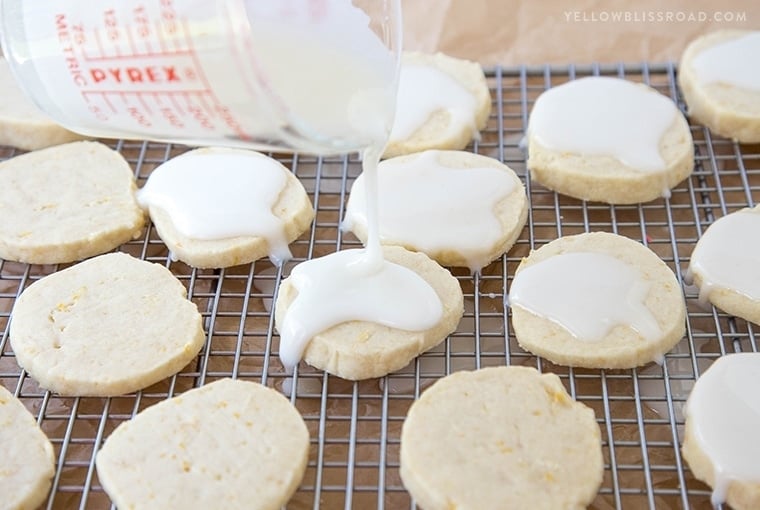Lemon Shortbread Cookies - Rich, buttery cookies with a hint of lemon, smothered in a sweet and tart lemon icing.
