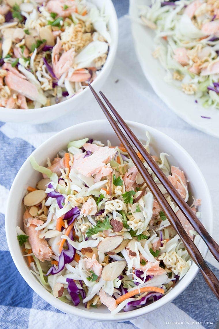 Three bowls of ramen noodle salad with salmon