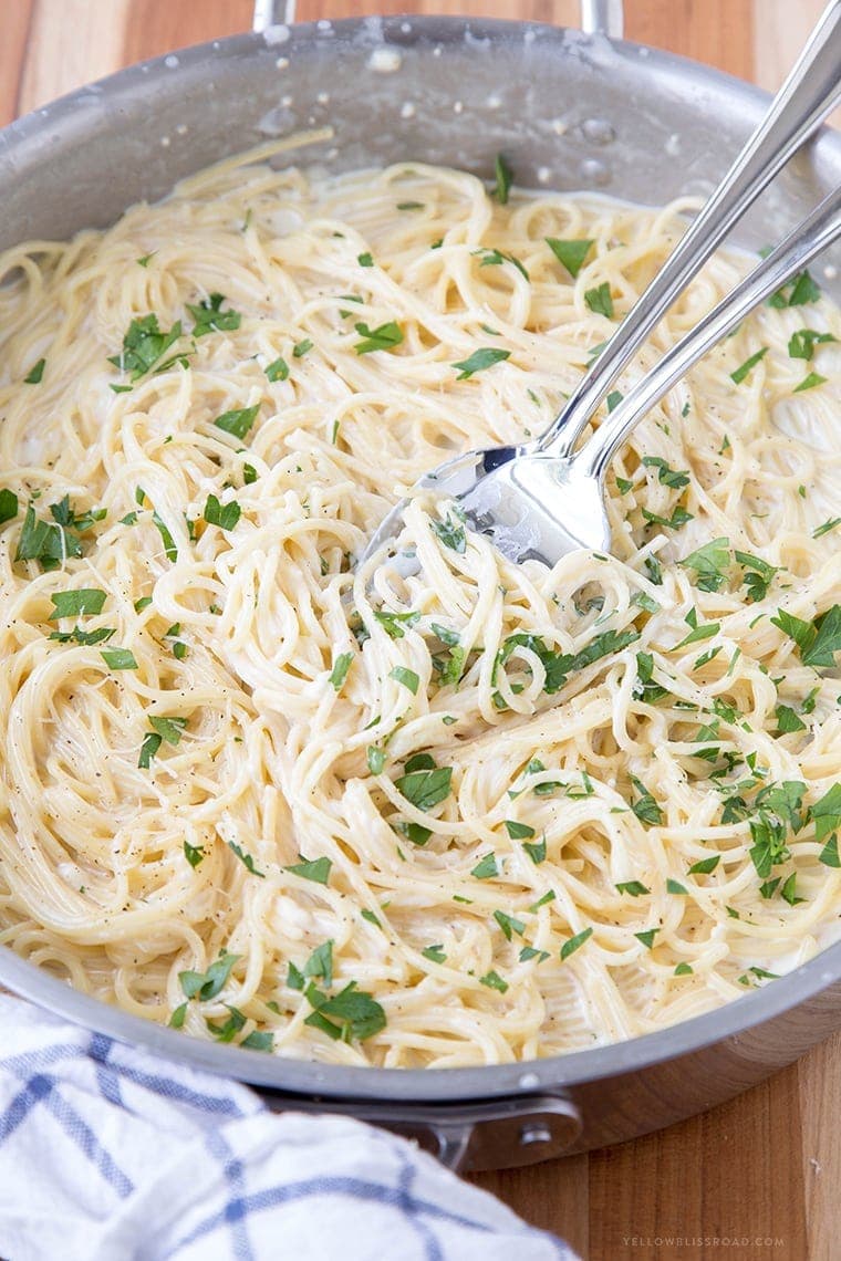 Creamy Four Cheese Spaghetti that's ready in 20 minutes! This is a fantastic and easy meal perfect for busy weeknights!