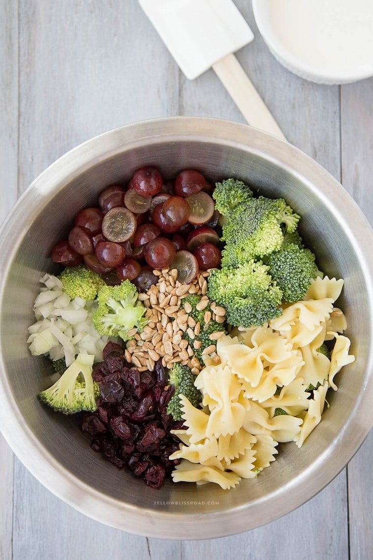 Lightened Up Creamy Broccoli & Grape Pasta Salad is a Classic Broccoli Salad lightened up with Greek Yogurt and sweetened with honey and grapes - this is the perfect side dish any time of the year