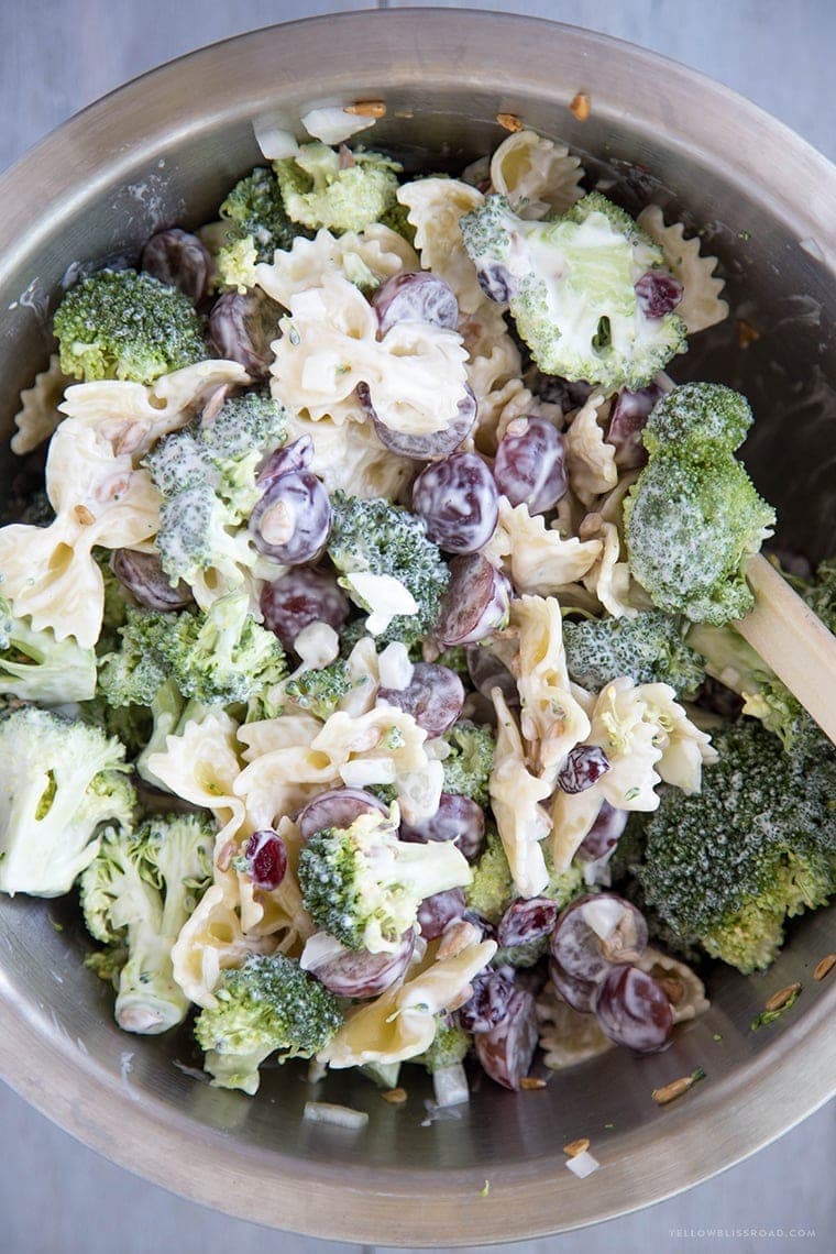 Lightened Up Creamy Broccoli & Grape Pasta Salad is a Classic Broccoli Salad lightened up with Greek Yogurt and sweetened with honey and grapes - this is the perfect side dish any time of the year