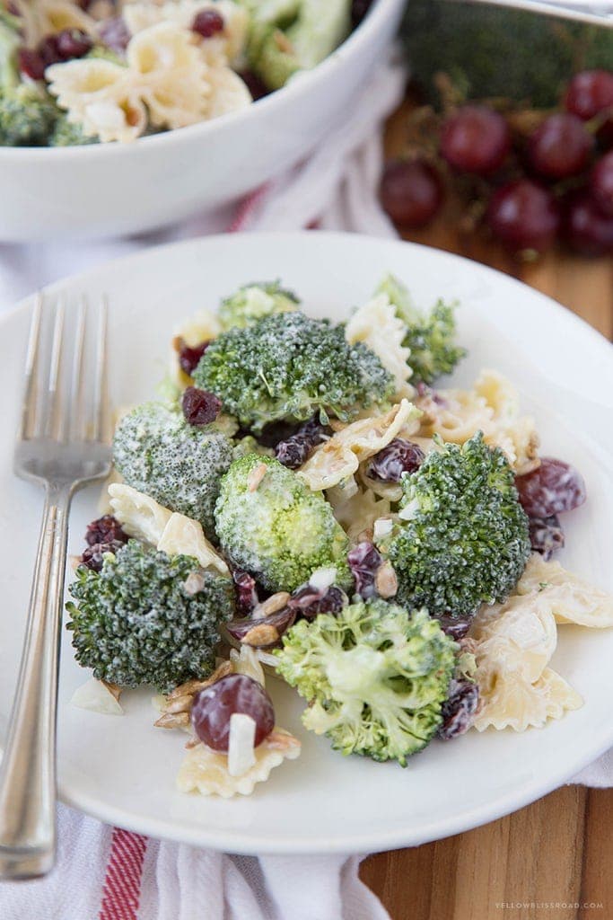 Lightened Up Creamy Broccoli & Grape Pasta Salad is a Classic Broccoli Salad lightened up with Greek Yogurt and sweetened with honey and grapes - this is the perfect side dish any time of the year