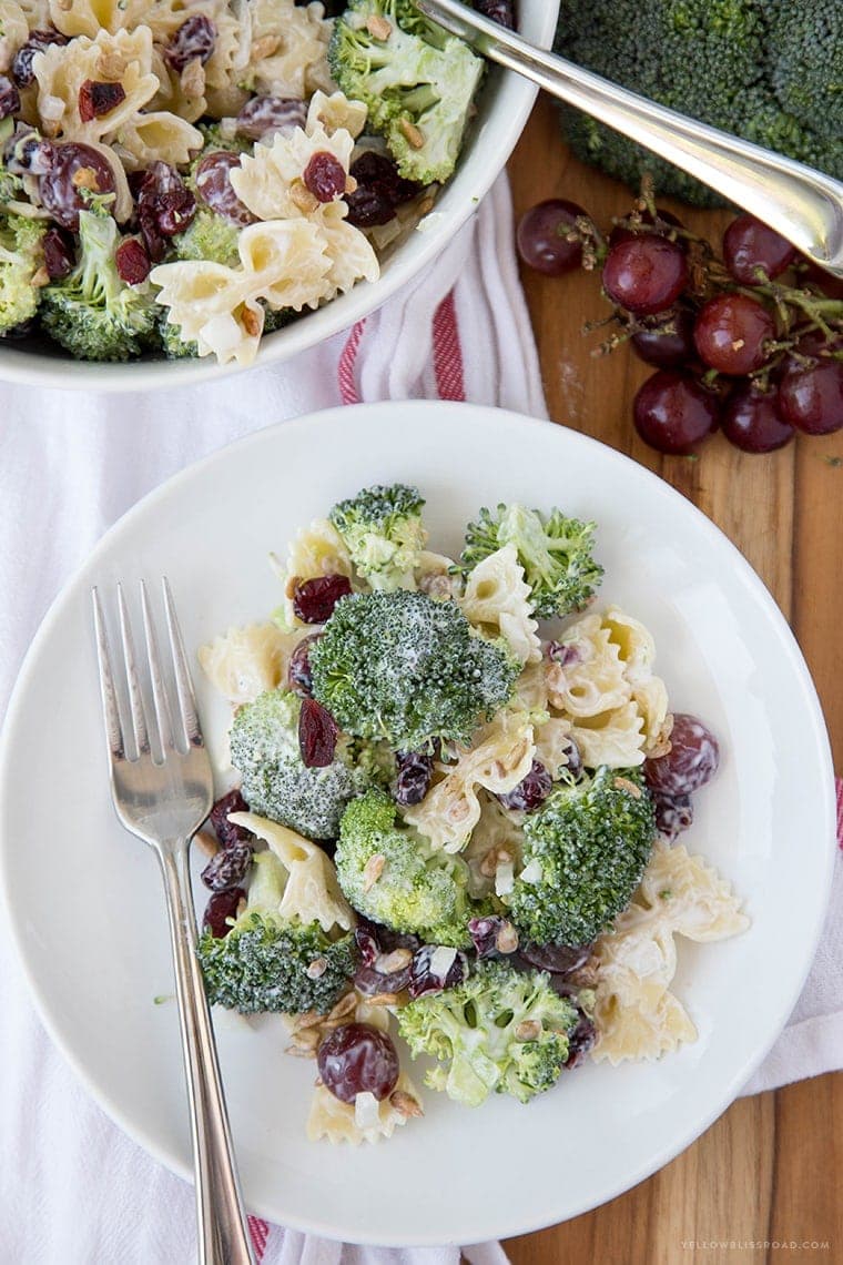 Lightened Up Creamy Broccoli & Grape Pasta Salad is a Classic Broccoli Salad lightened up with Greek Yogurt and sweetened with honey and grapes - this is the perfect side dish any time of the year