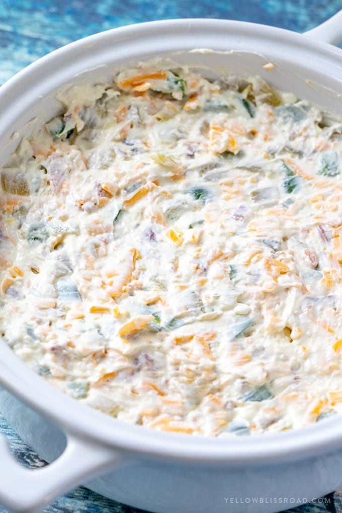 Cream cheese jalapeno dip in a white bowl unbaked.