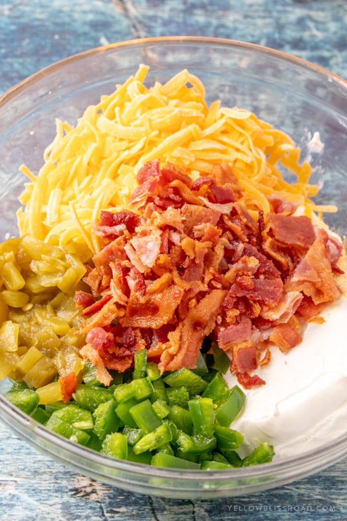 Ingredients in a bowl to make jalapeno popper dip