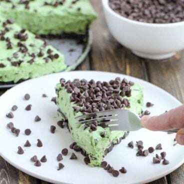 This No Bake Mint Chocolate Chip Pie is fast, easy, and filled with chocolate chips and mint candies. It's the perfect summer night treat!