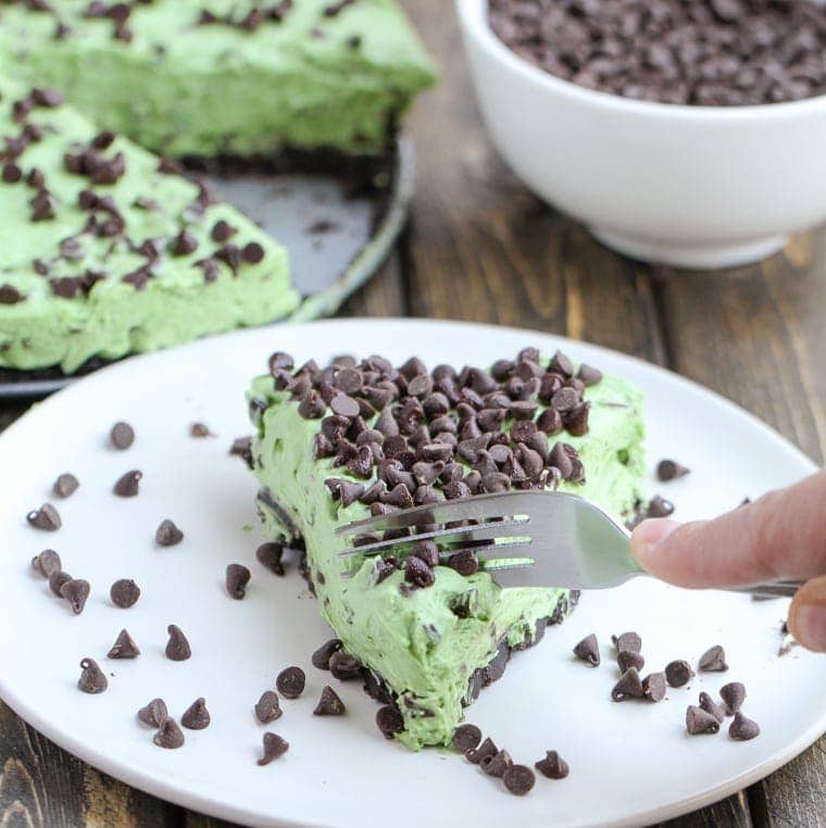 This No Bake Mint Chocolate Chip Pie is fast, easy, and filled with chocolate chips and mint candies. It's the perfect summer night treat! 