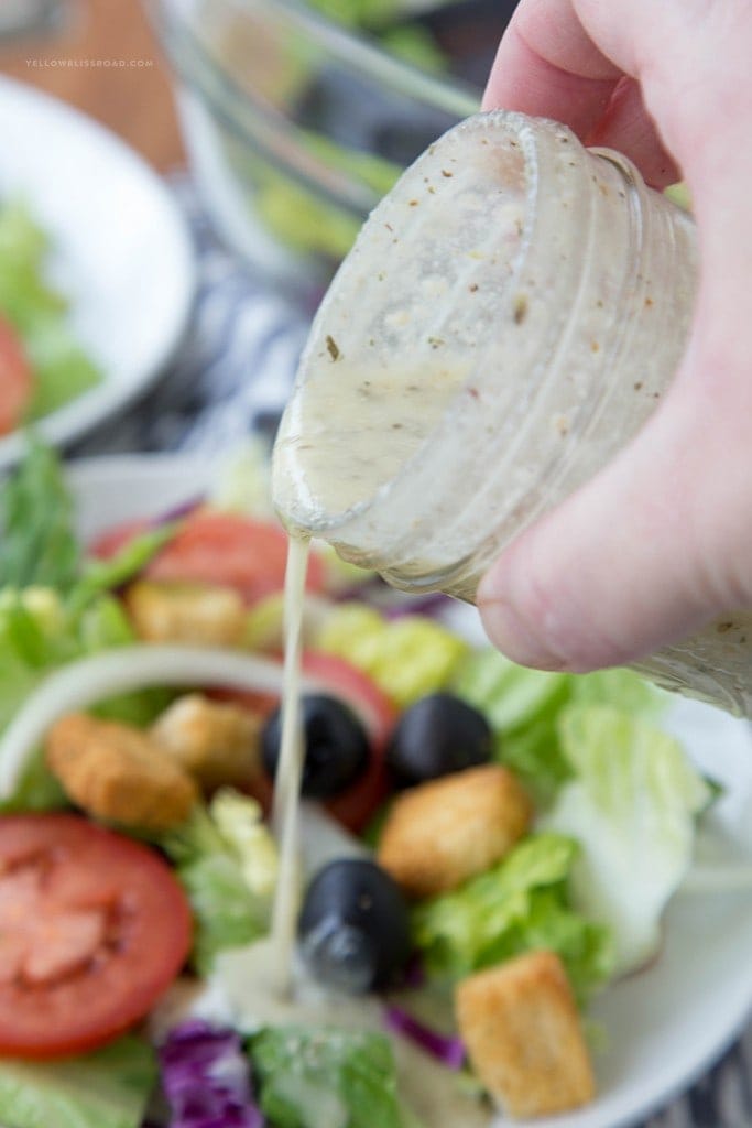 olive garden Salad dressing pouring over a salad