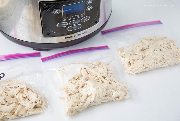 Slow cooker shredded chicken breasts portioned into bags