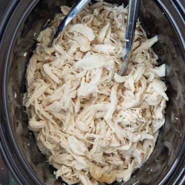 Crockpot filled with shredded chicken