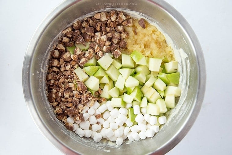 Twix Apple Fluff Salad - with pineapple, caramel, marshmallows in a yummy vanilla Cool Whip dressing! Perfect dessert salad for picnics or potlucks!