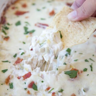 A close up of dip and a chip