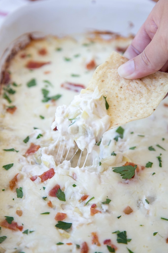 Creamy Artichoke & Chicken Dip - Super creamy and cheesy dip that's perfect as an appetizer or snack for parties or tailgating!