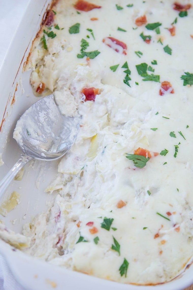 Creamy Artichoke & Chicken Dip - Super creamy and cheesy dip that's perfect as an appetizer or snack for parties or tailgating!