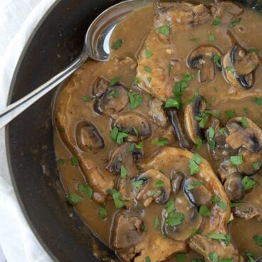 A pan filled with French Onion Pork Chops