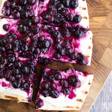 Grilled Blueberry Dessert Pizza is a perfect dessert for your next cookout! Prep your ingredients ahead of time and bring everything together in just 10 minutes!