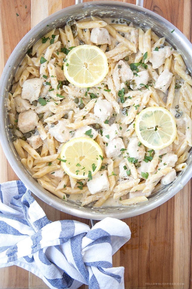 One Pan Creamy Lemon Chicken Picatta Pasta - Tender chicken and pasta are coated with a luscious lemony cream sauce with capers. Easy weeknight dinner that's classy enough for company.