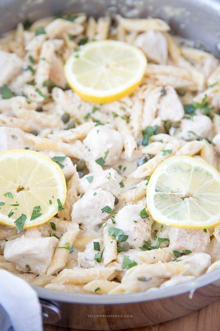 One Pan Creamy Lemon Chicken Picatta Pasta - Tender chicken and pasta are coated with a luscious lemony cream sauce with capers. Easy weeknight dinner that's classy enough for company.