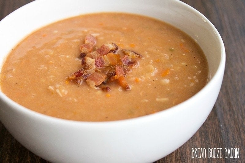 An image of a bowl of bacon and bean soup.