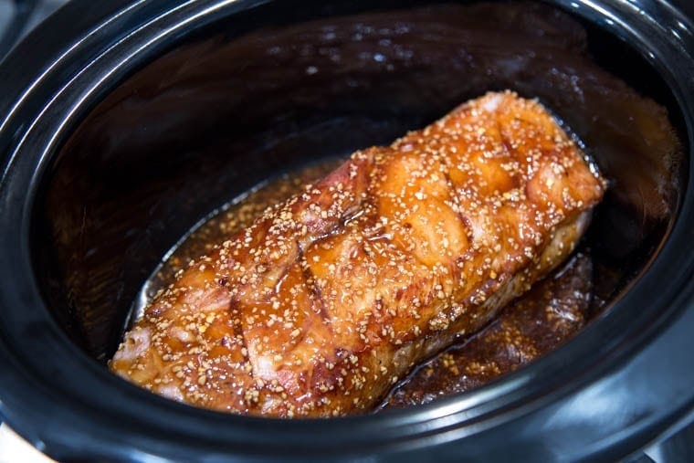 Slow Cooker Brown Sugar & Garlic Teriyaki Pork - Just a few ingredients make this crock pot meal a sure winner for your busy weeknight dinner. Just add rice and veggies for a complete meal!