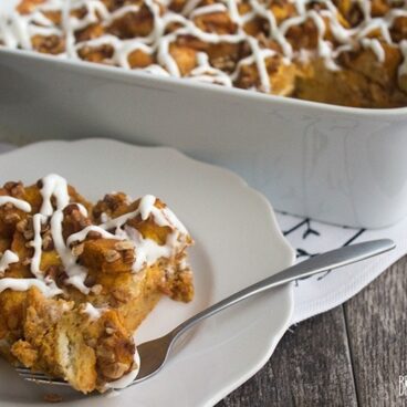 Nothing says fall like a big piece of Pumpkin Bread Pudding drizzled with cream cheese glaze!