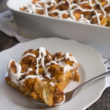 Nothing says fall like a big piece of Pumpkin Bread Pudding drizzled with cream cheese glaze!
