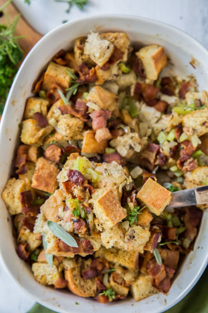 a dish filled with homemade stuffing with bacon