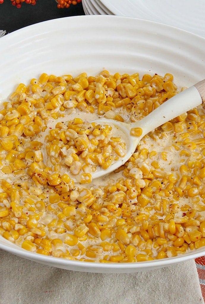 Slow Cooker Creamy Corn - Sweet corn in a creamy sauce, made easily in your slow cooker and perfect for Thanksgiving!