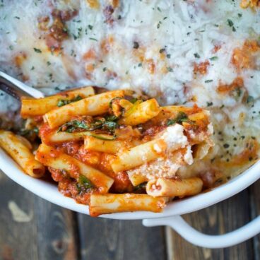 A classic comfort food that is baked with spinach, ziti noodles, pasta sauce, and so many cheeses. It's easy to make and perfect for a crowd.