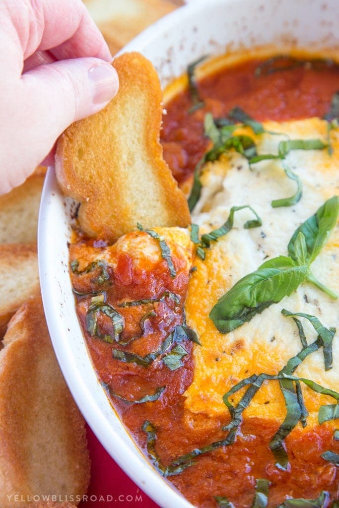 Baked Goat Cheese & Marinara Dip with Crostini - A festive holiday appetizer!