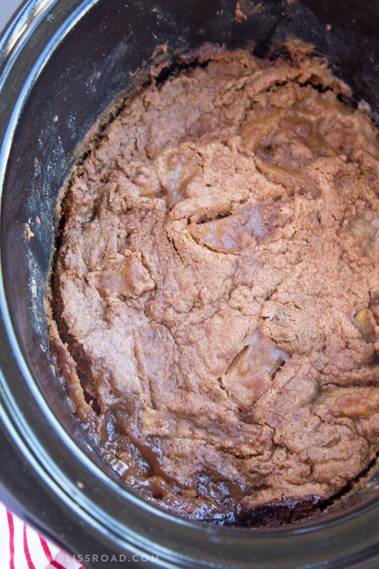 This Slow Cooker Caramel Apple Spice Cake is just the right dessert for your holiday gatherings. It's sweet, with moist spice cake and tender, tart apples.