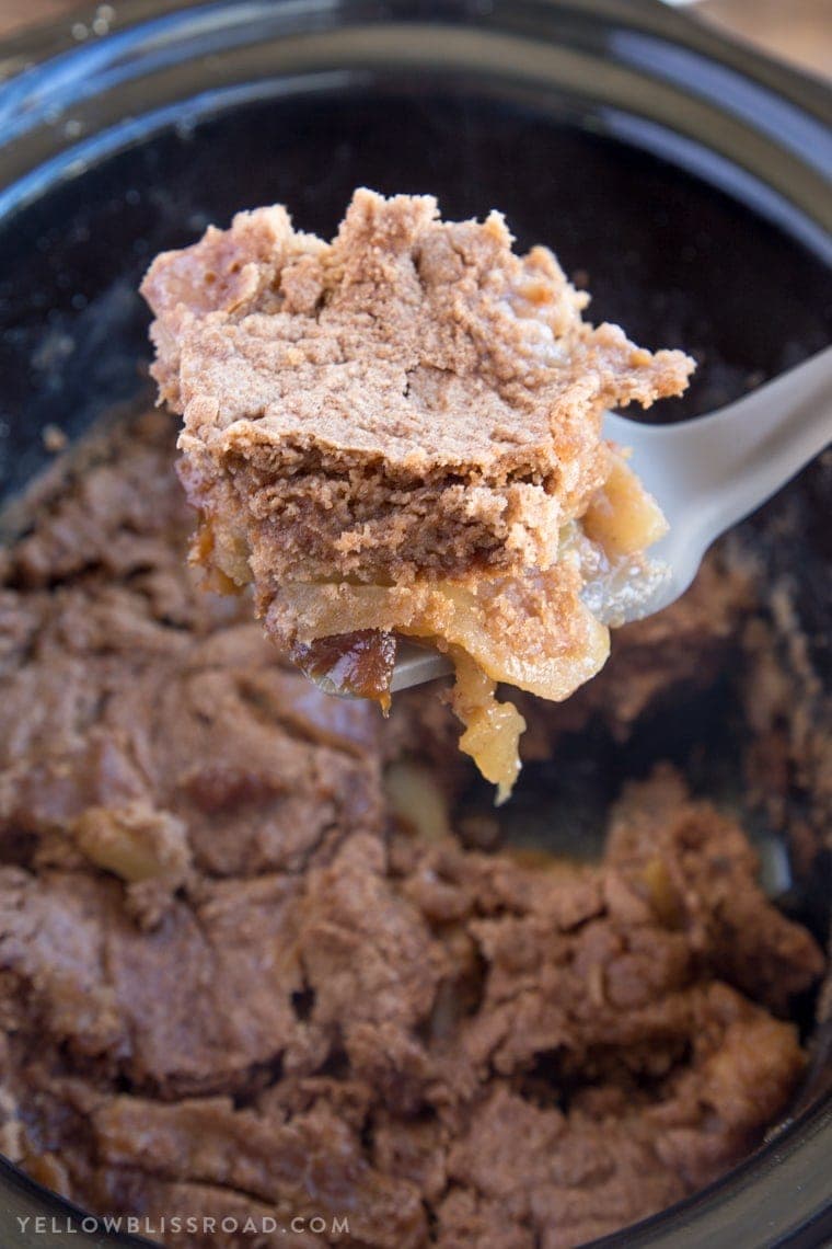 This Slow Cooker Caramel Apple Spice Cake is just the right dessert for your holiday gatherings. It's sweet, with moist spice cake and tender, tart apples.