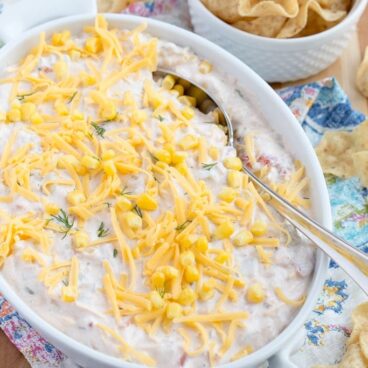 A bowl of cheesy corn dip